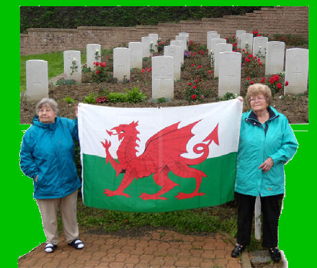 Holding up Welsh Flag at the cemetery